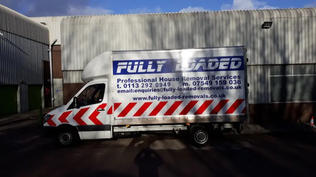 Fully Loaded Removals Luton van at a commercial unit